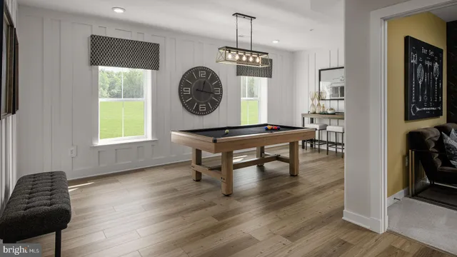 a view of a room with a wooden floor and a window