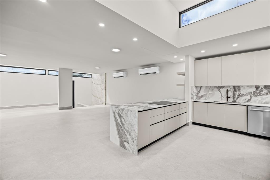 373 Guaynabo Prairie Guaynabo, PR 00969 - Photo 8 of 17 a kitchen with granite countertop white cabinets and white appliances