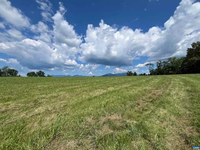 a view of a town with mountains in the background