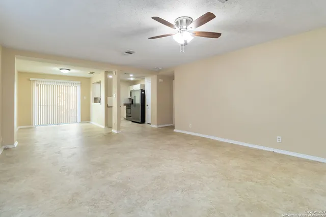 an empty room with a bathroom