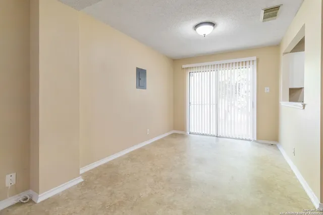 an empty room with windows