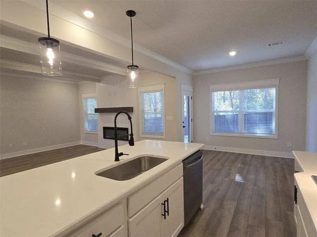 a kitchen with sink and window