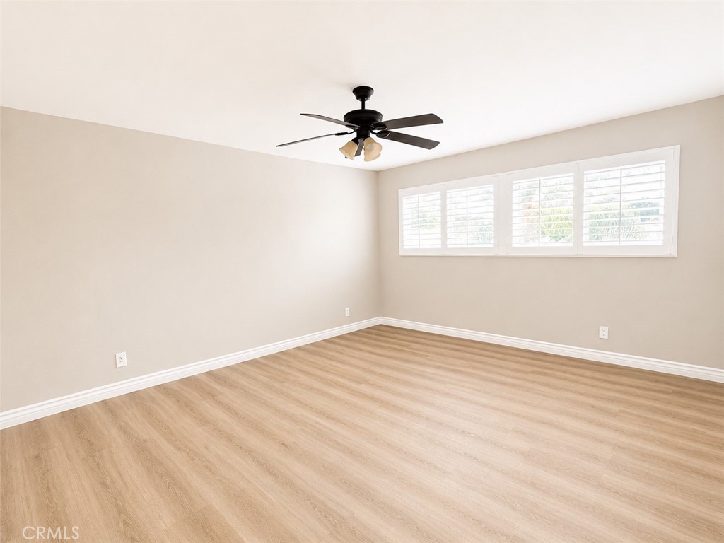 1118 West Orange Road Santa Ana, CA 92706 - Photo 12 of 18 wooden floor in an empty room with a window