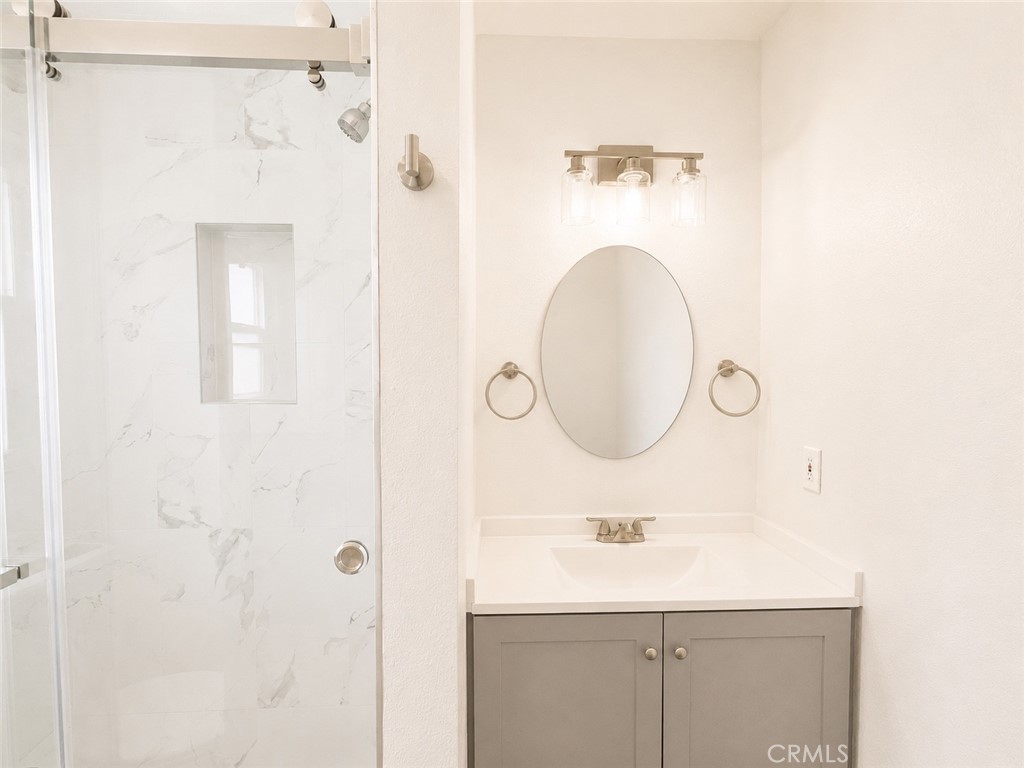 1118 West Orange Road Santa Ana, CA 92706 - Photo 14 of 18 a bathroom with a sink and a mirror