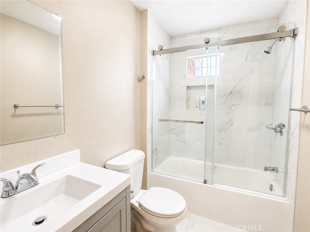 1118 West Orange Road Santa Ana, CA 92706 - Photo 8 of 18 a bathroom with a sink toilet and shower
