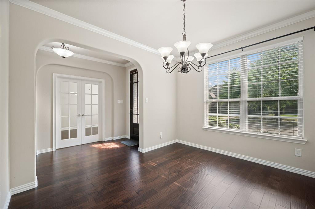 12809 Spring Hill Drive Frisco, TX 75035 - Photo 8 of 37 a view of an empty room with a window and wooden floor