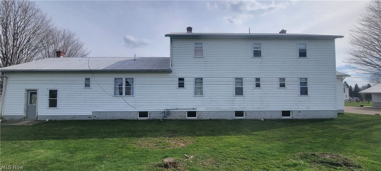 15560 Burton-Windsor Road Middlefield, OH 44062 - Photo 45 of 45 Back of house with a lawn