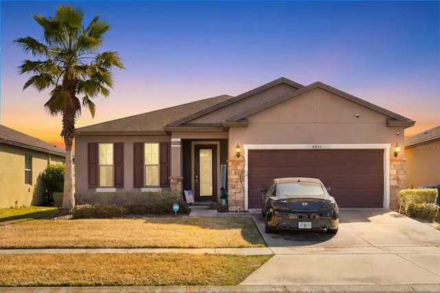 a car parked in front of a house