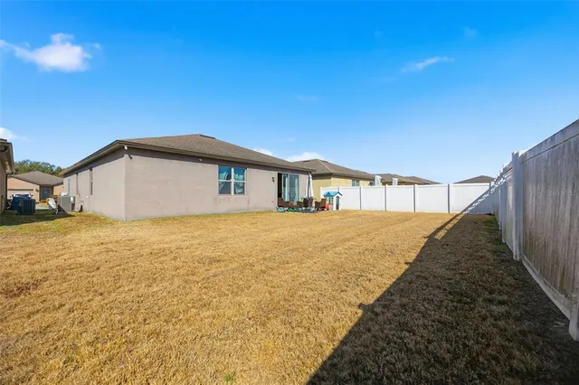 a house with yard in front of it