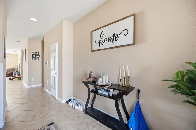 a view of a hallway with seating area
