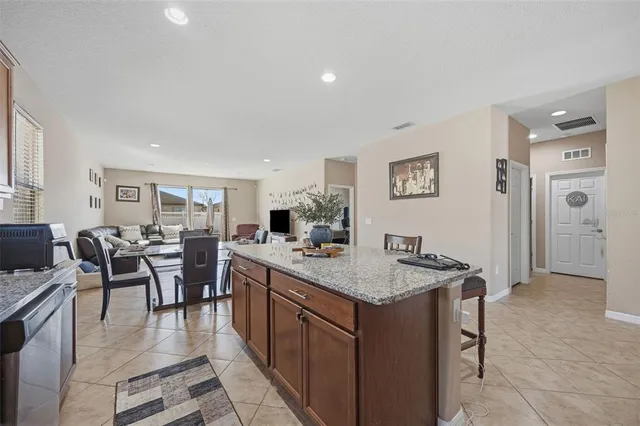 a kitchen with a table and chairs