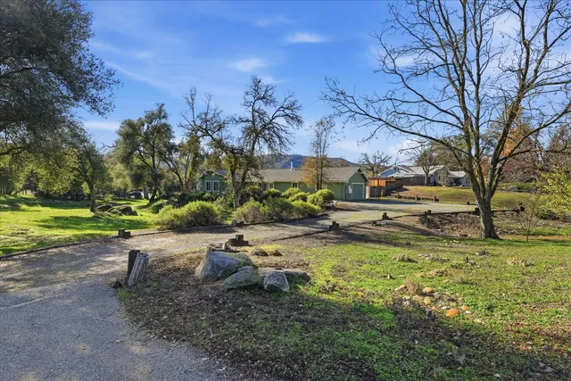 a view of a yard with swimming pool
