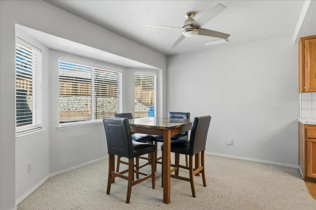 a view of a dining room with furniture window and outside view