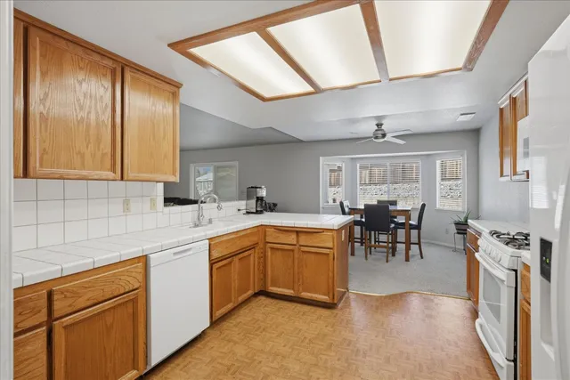 a kitchen with lots of counter top space and dining table