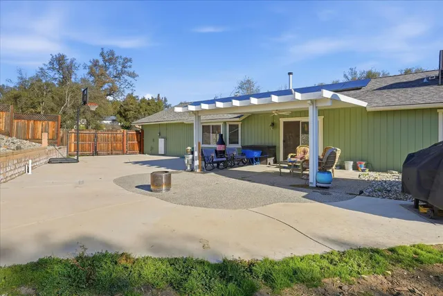 a room with lots of trees and furniture
