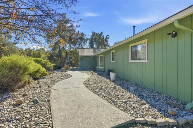 a house view with a backyard space