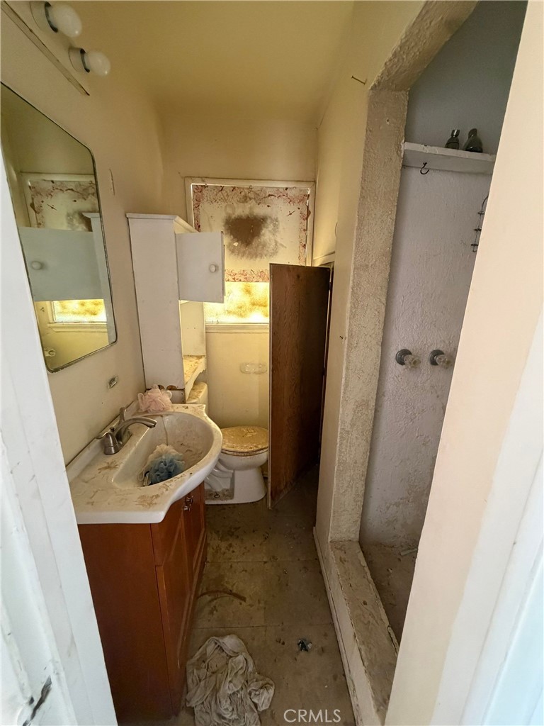 6316 Isleta Road Twentynine Palms, CA 92277 - Photo 9 of 13 a bathroom with a sink and a mirror