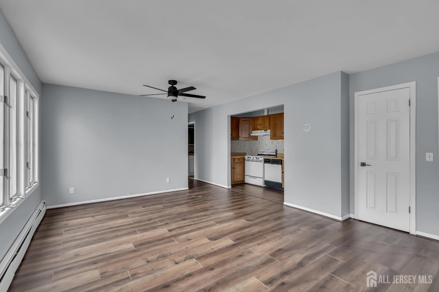 1595 East 2nd Street, Unit 2 Scotch Plains, NJ 07076 - Photo 5 of 13 wooden floor in an empty room with a window