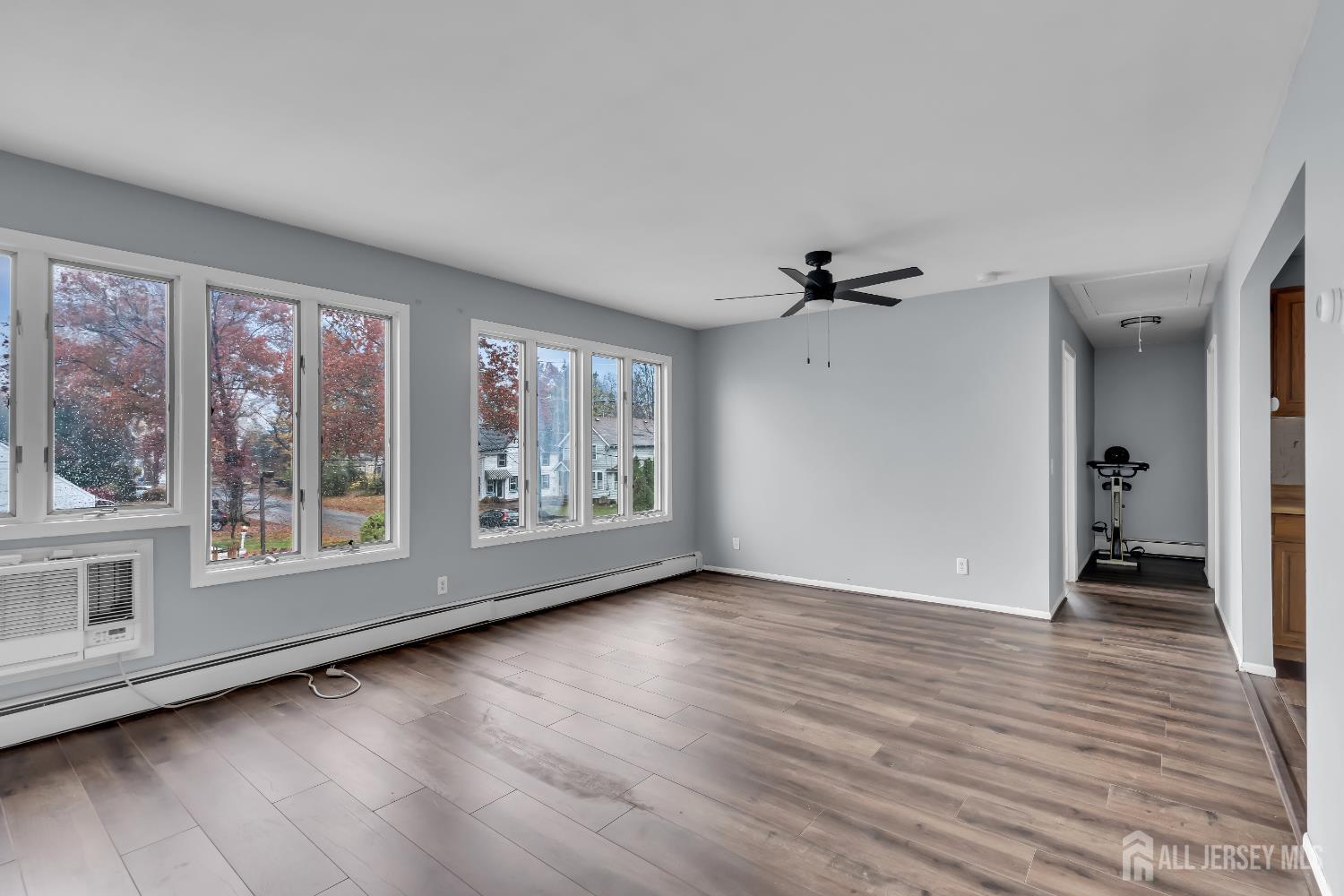 1595 East 2nd Street, Unit 2 Scotch Plains, NJ 07076 - Photo 6 of 13 a view of an empty room with a window and wooden floor