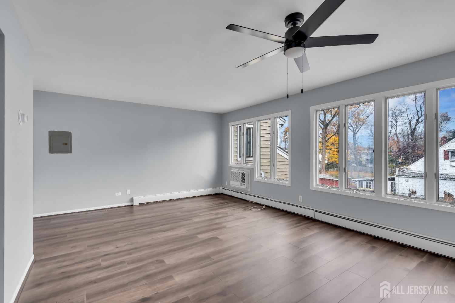 1595 East 2nd Street, Unit 2 Scotch Plains, NJ 07076 - Photo 7 of 13 wooden floor in an empty room with a window