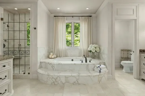 a bathroom with a bathtub and a shower