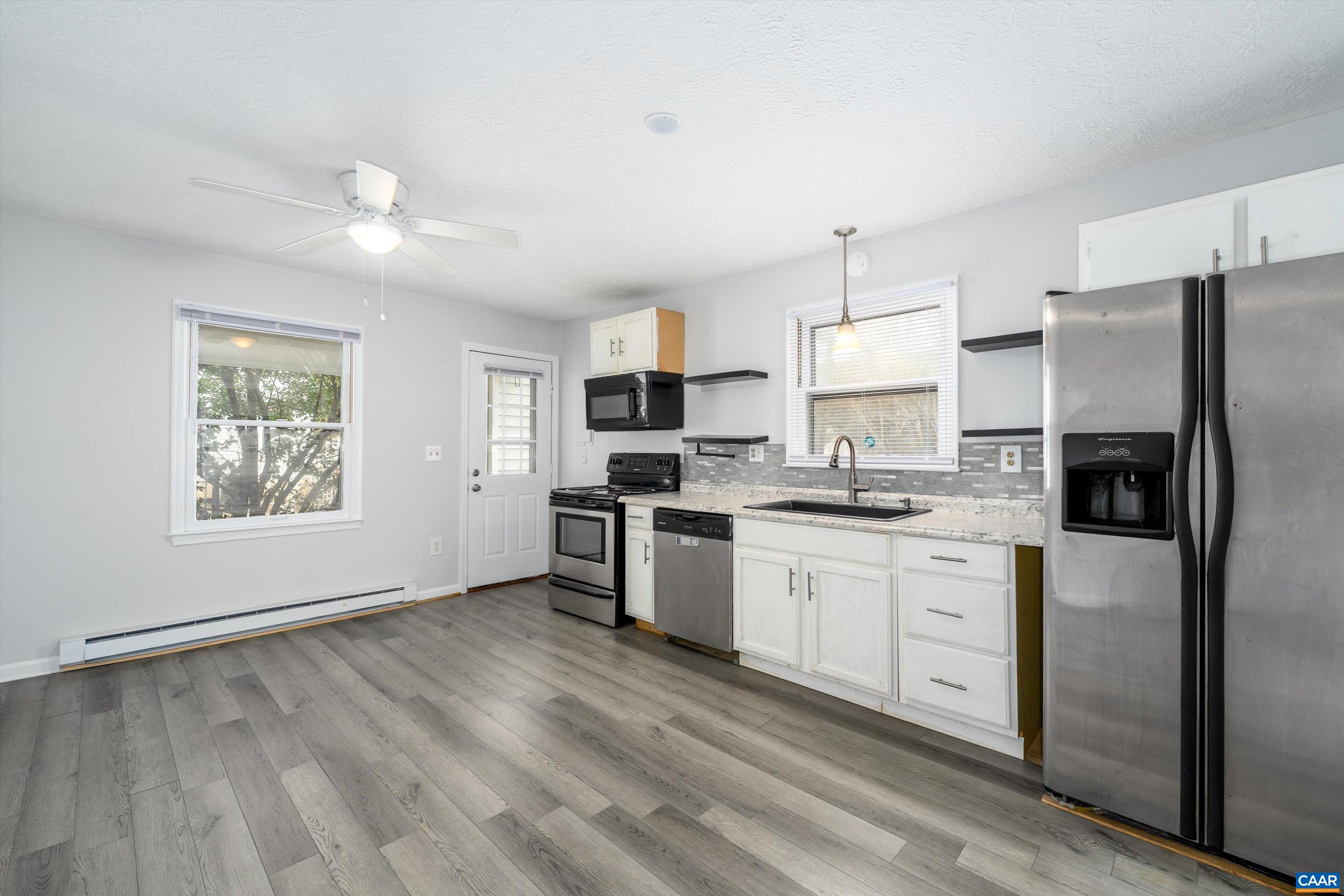 9 Pleasant View Terrace Palmyra, VA 22963 - Photo 12 of 34 a kitchen with granite countertop a refrigerator stove top oven and sink