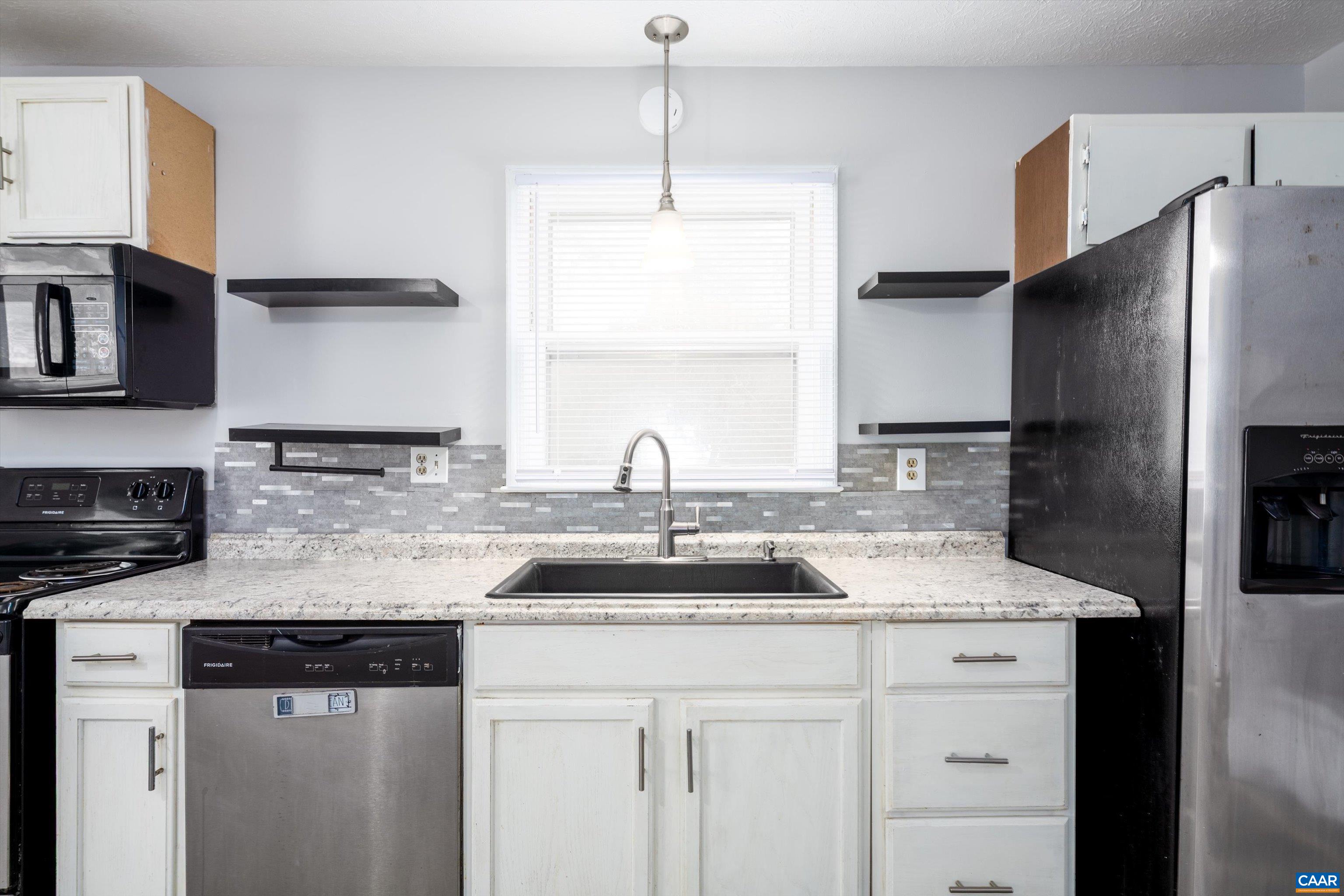 9 Pleasant View Terrace Palmyra, VA 22963 - Photo 14 of 34 a kitchen with stainless steel appliances granite countertop a sink and a refrigerator