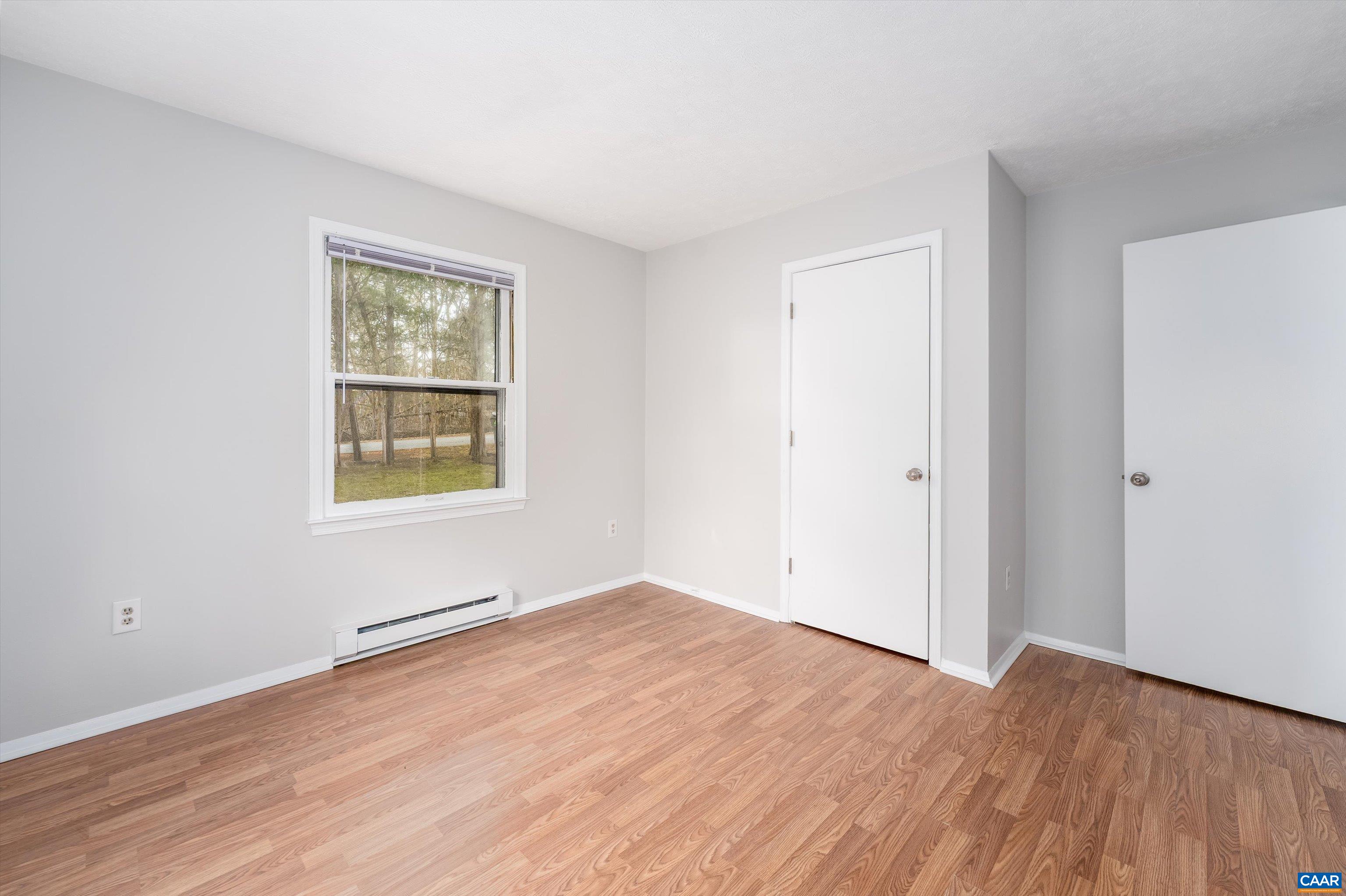 9 Pleasant View Terrace Palmyra, VA 22963 - Photo 20 of 34 an empty room with wooden floor and windows