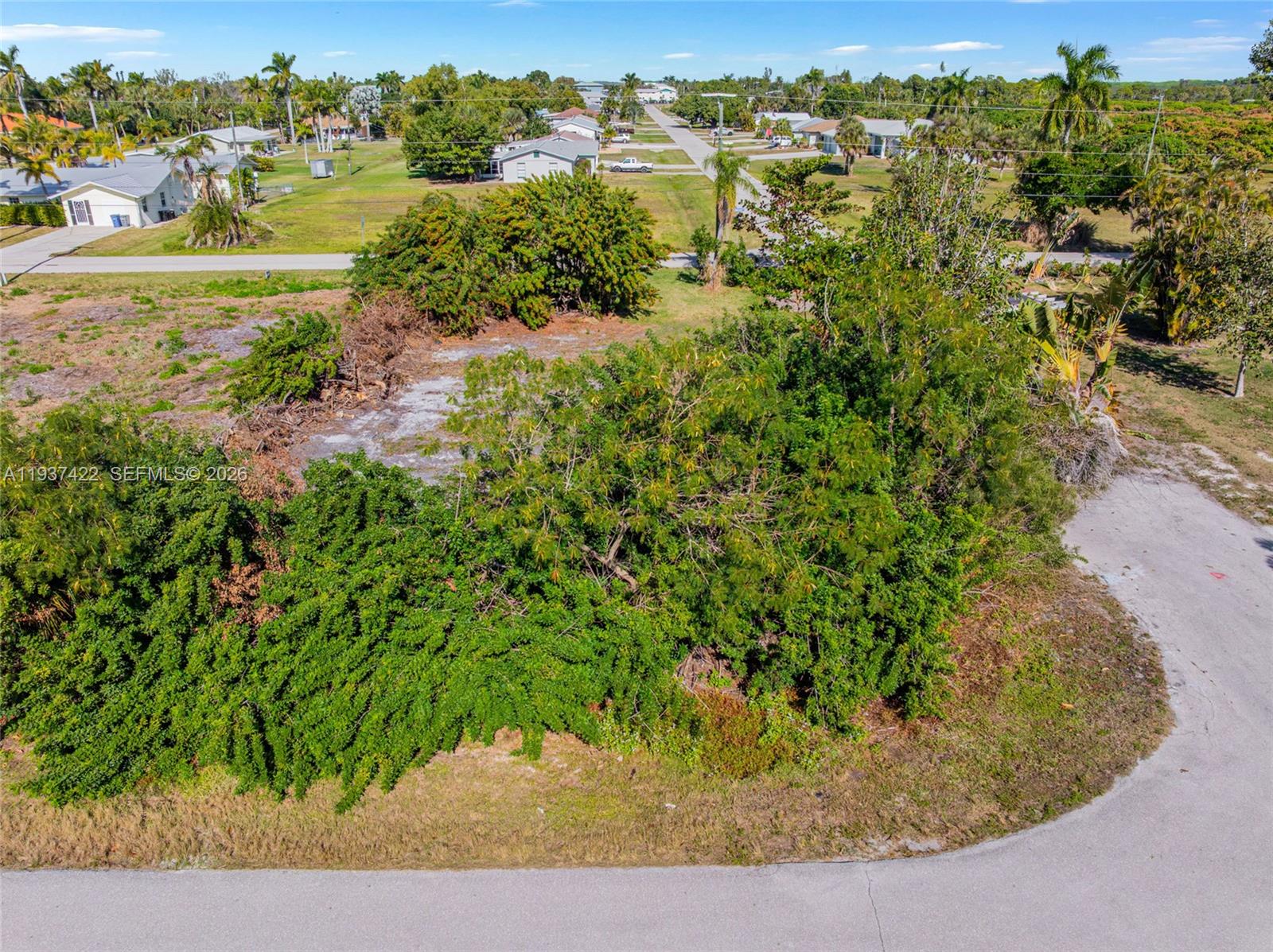 7324 Cobb Road Bokeelia, FL 33922 - Photo 14 of 24 an aerial view of a houses with a yard