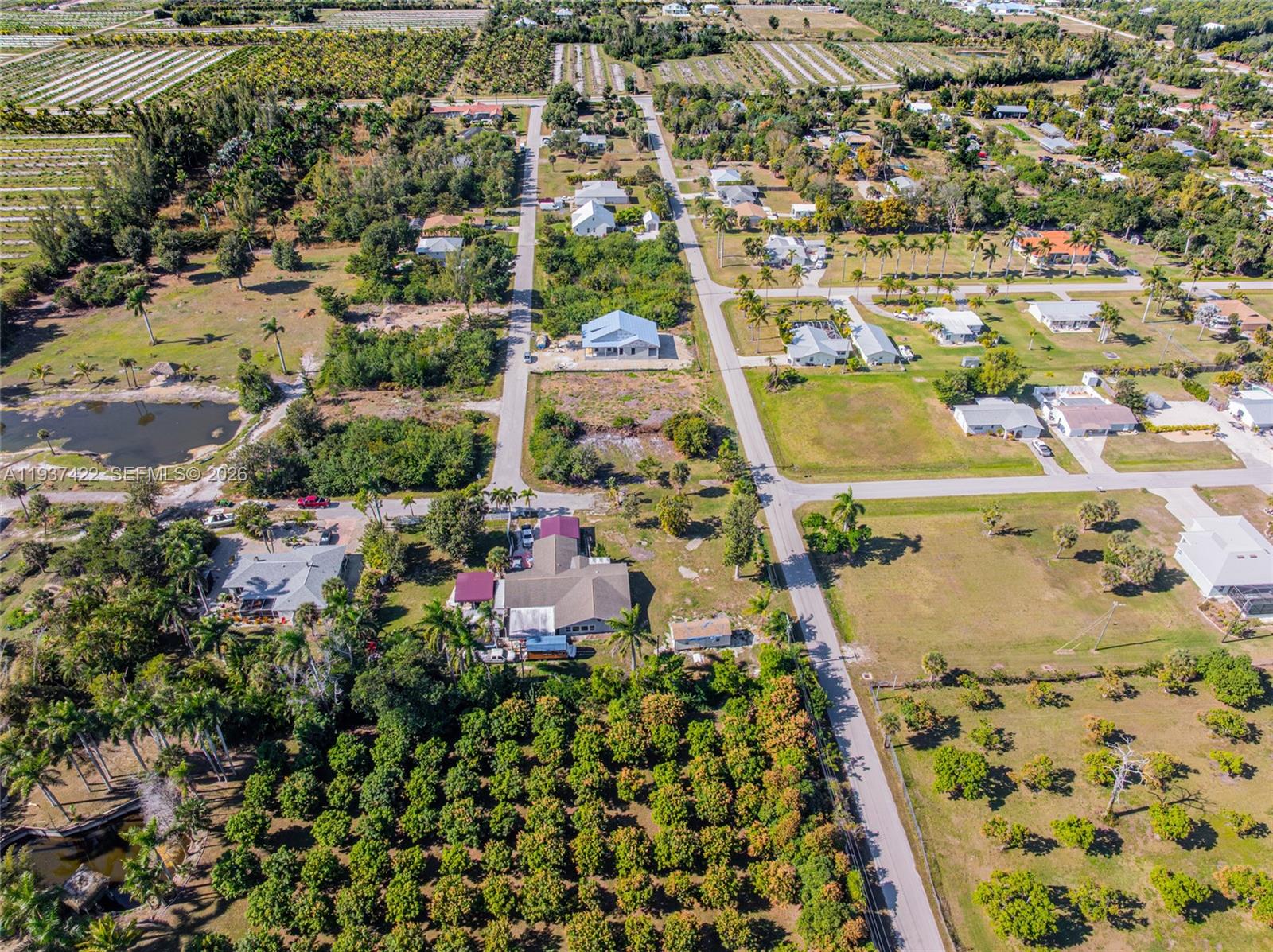 7324 Cobb Road Bokeelia, FL 33922 - Photo 19 of 24 an aerial view of residential houses with outdoor space