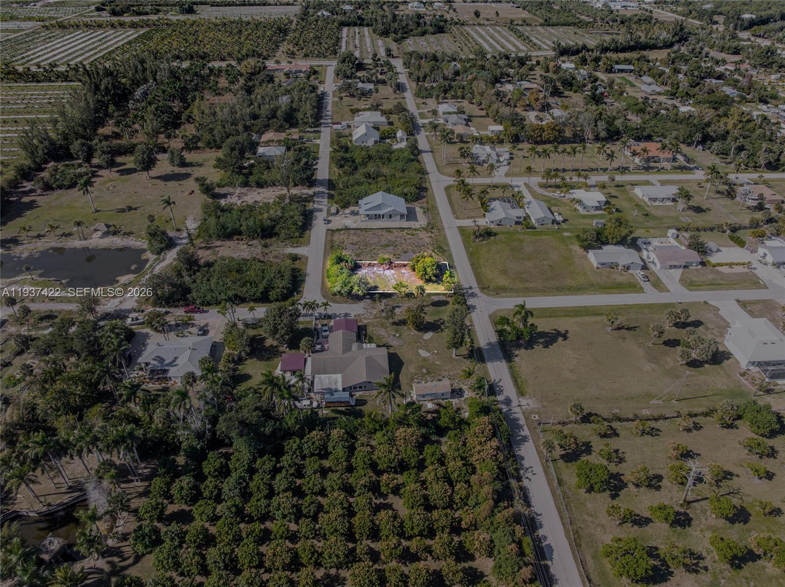 7324 Cobb Road Bokeelia, FL 33922 - Photo 22 of 24 an aerial view of residential house with outdoor space