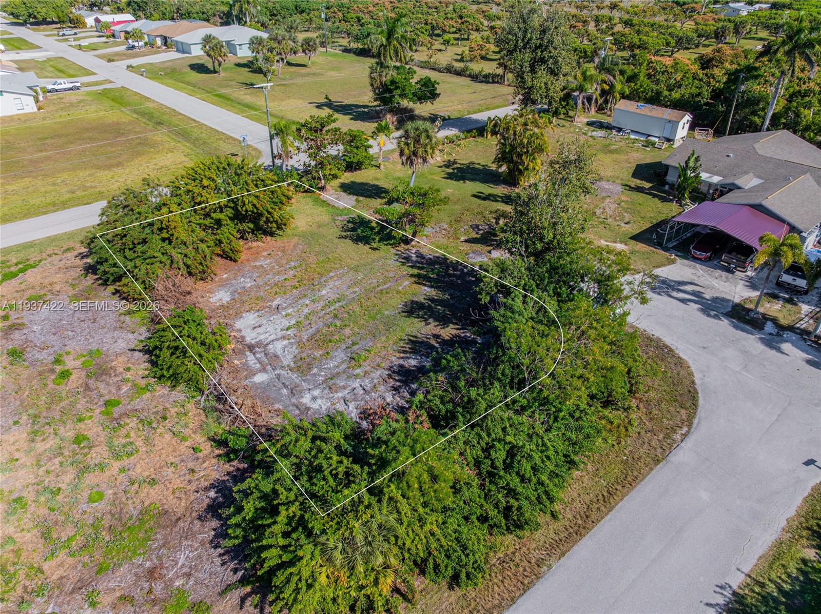 7324 Cobb Road Bokeelia, FL 33922 - Photo 9 of 24 an aerial view of residential houses with outdoor space and lake view