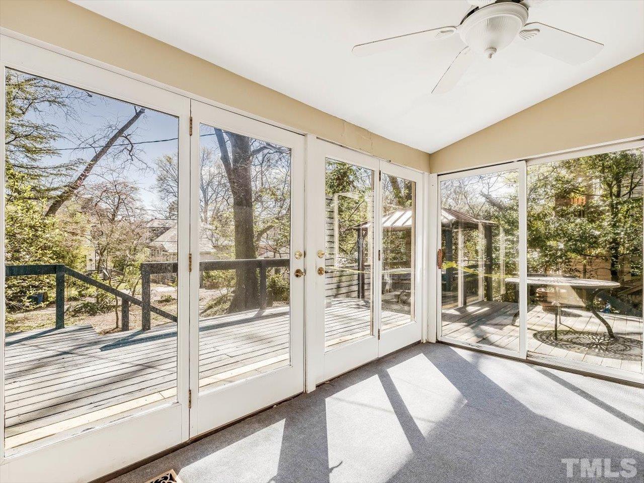 118 Hawthorne Road Raleigh, NC 27605 - Photo 20 of 42 a room with sliding door and wooden floor