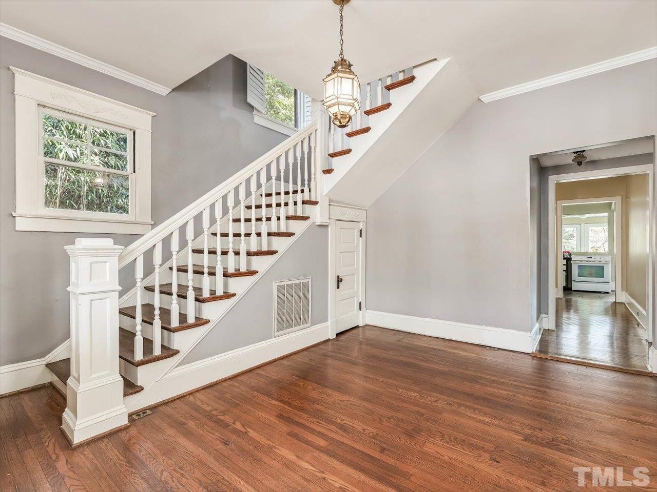 118 Hawthorne Road Raleigh, NC 27605 - Photo 8 of 42 a view of entryway and hall with wooden floor
