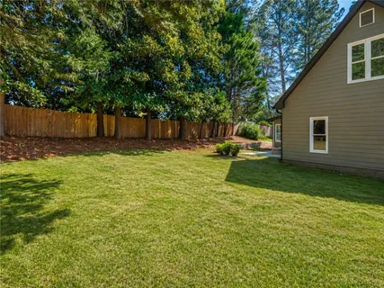 a view of a backyard with a small cabin
