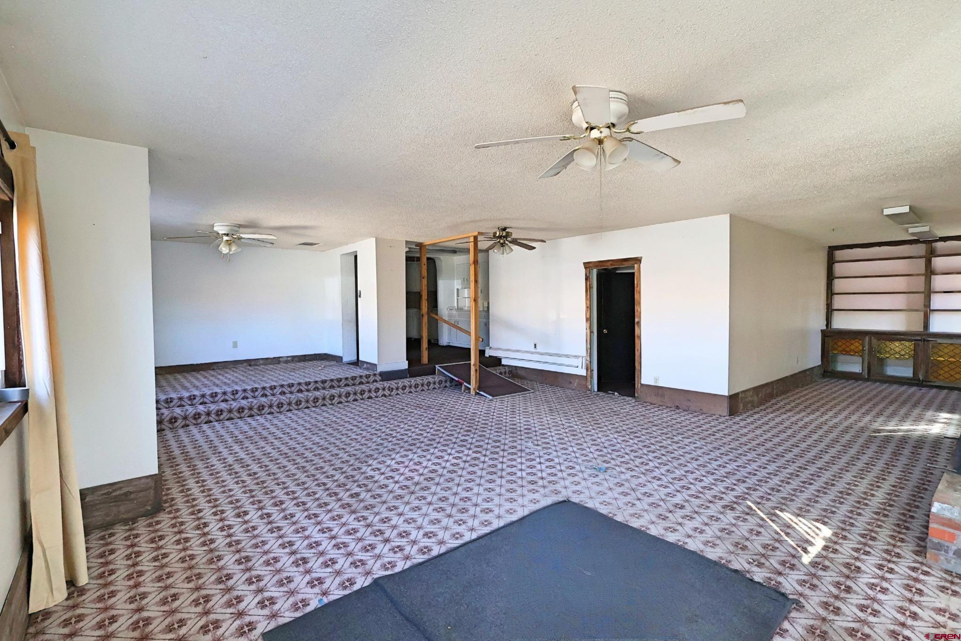 730 8th Street Alamosa, CO 81101 - Photo 1 of 29 an empty room with closet and a ceiling fan