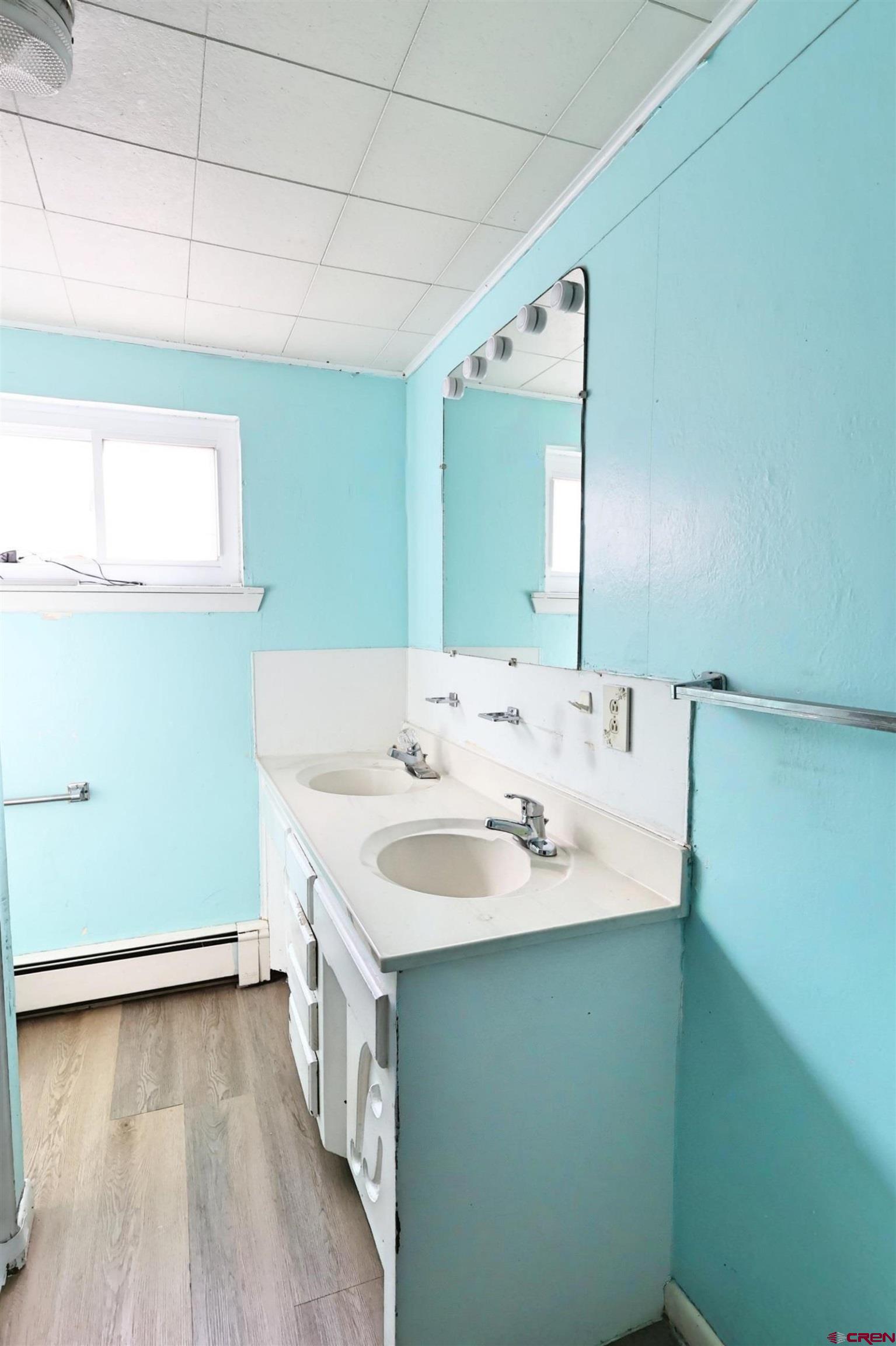 730 8th Street Alamosa, CO 81101 - Photo 11 of 29 a bathroom with a sink and a mirror