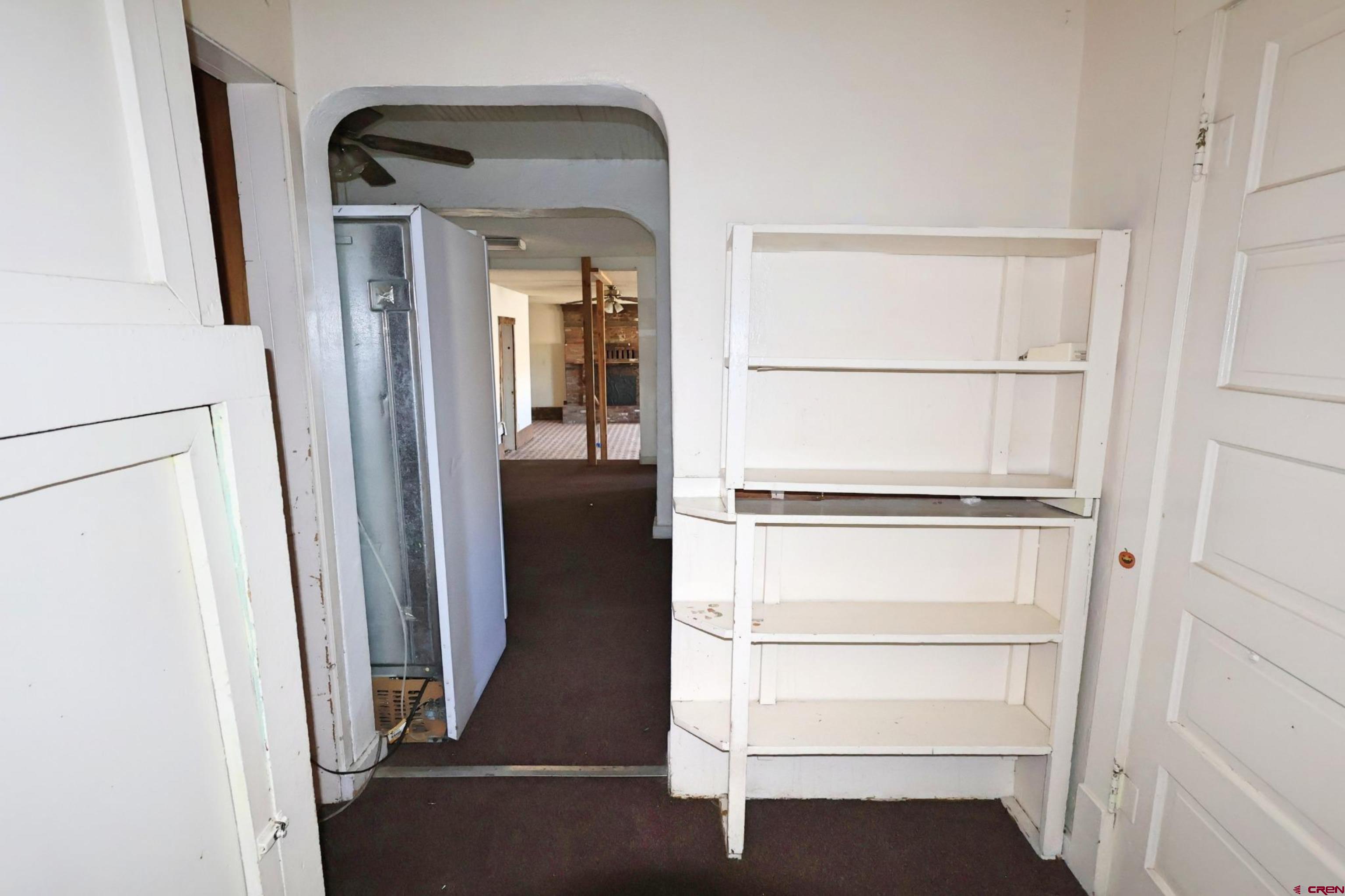730 8th Street Alamosa, CO 81101 - Photo 15 of 29 a view of walk in closet with empty racks