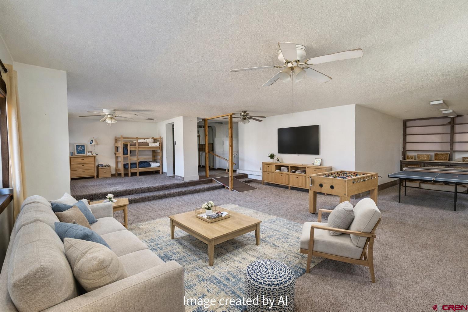 730 8th Street Alamosa, CO 81101 - Photo 2 of 29 a living room with furniture and a flat screen tv