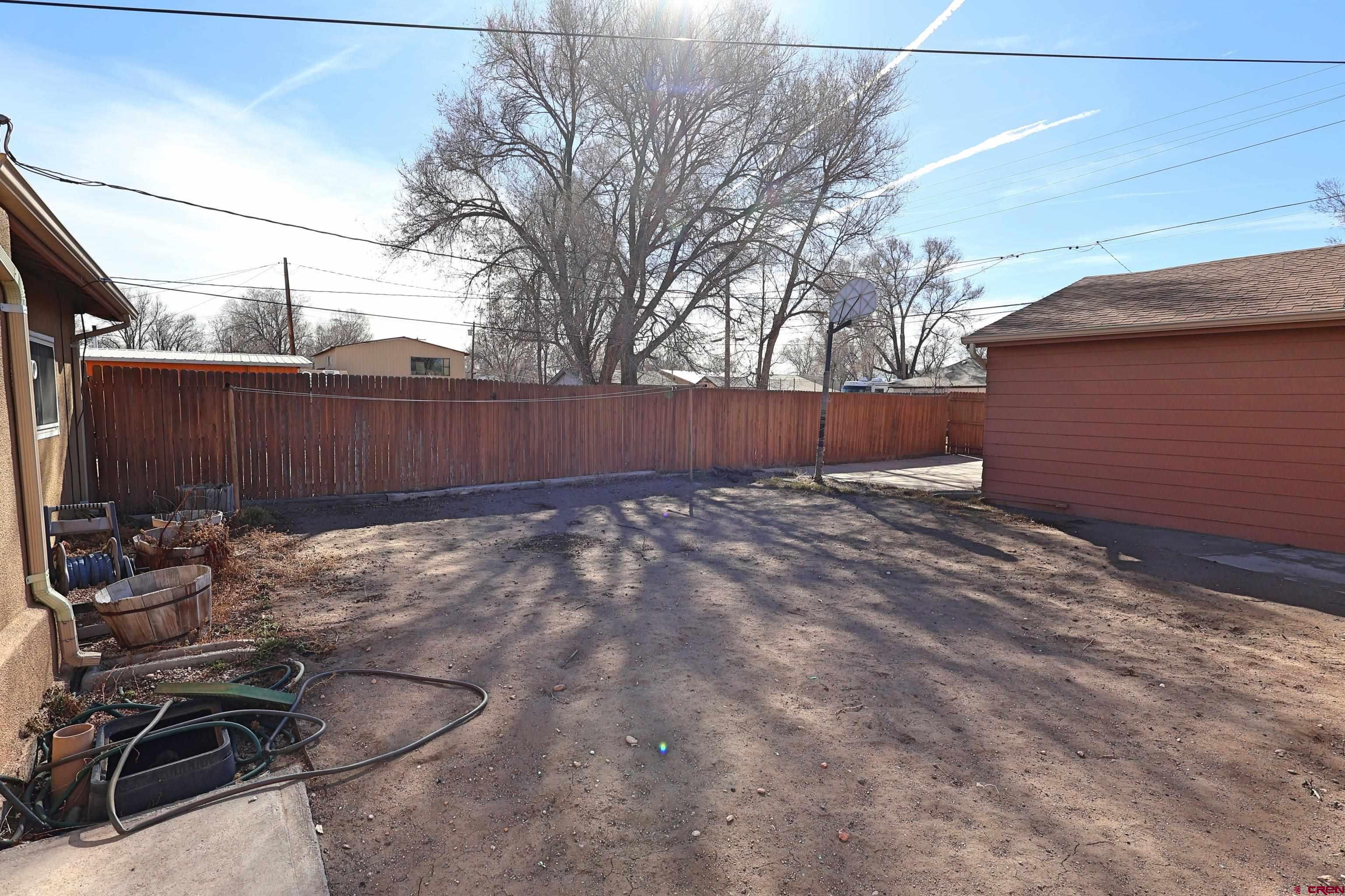 730 8th Street Alamosa, CO 81101 - Photo 22 of 29 a view of backyard with wooden fence
