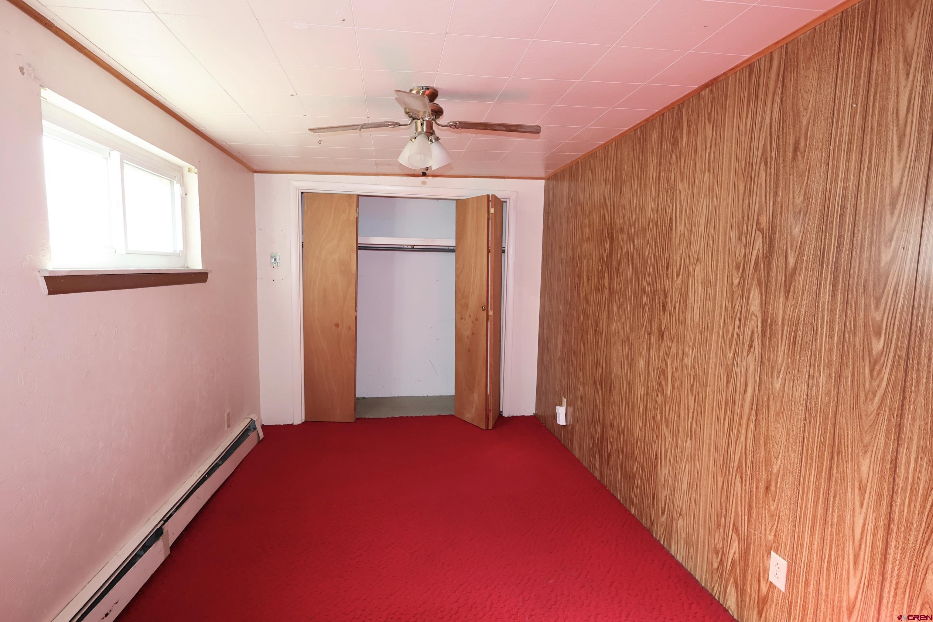 730 8th Street Alamosa, CO 81101 - Photo 8 of 29 a view of a hallway with a chandelier