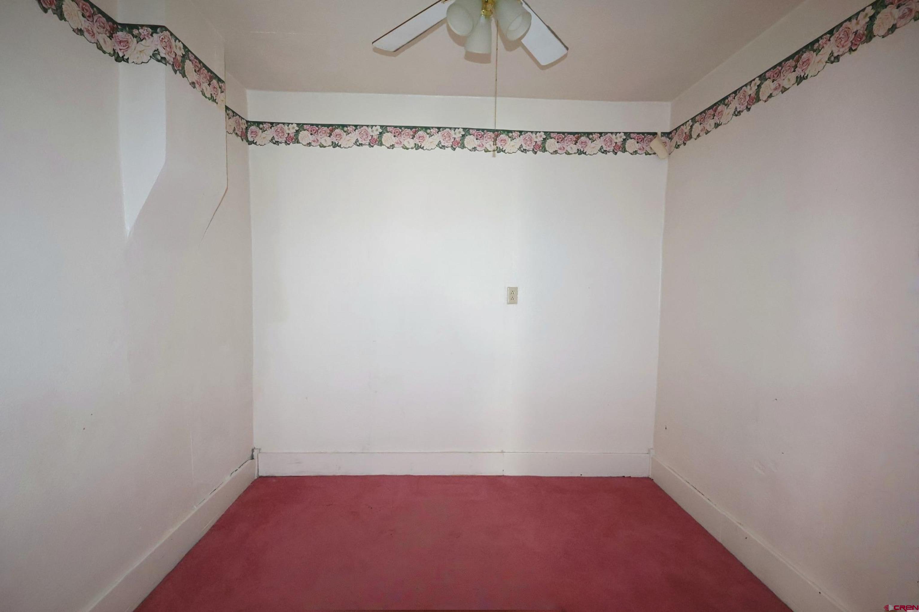 730 8th Street Alamosa, CO 81101 - Photo 10 of 29 a view of a room with racks on the wall