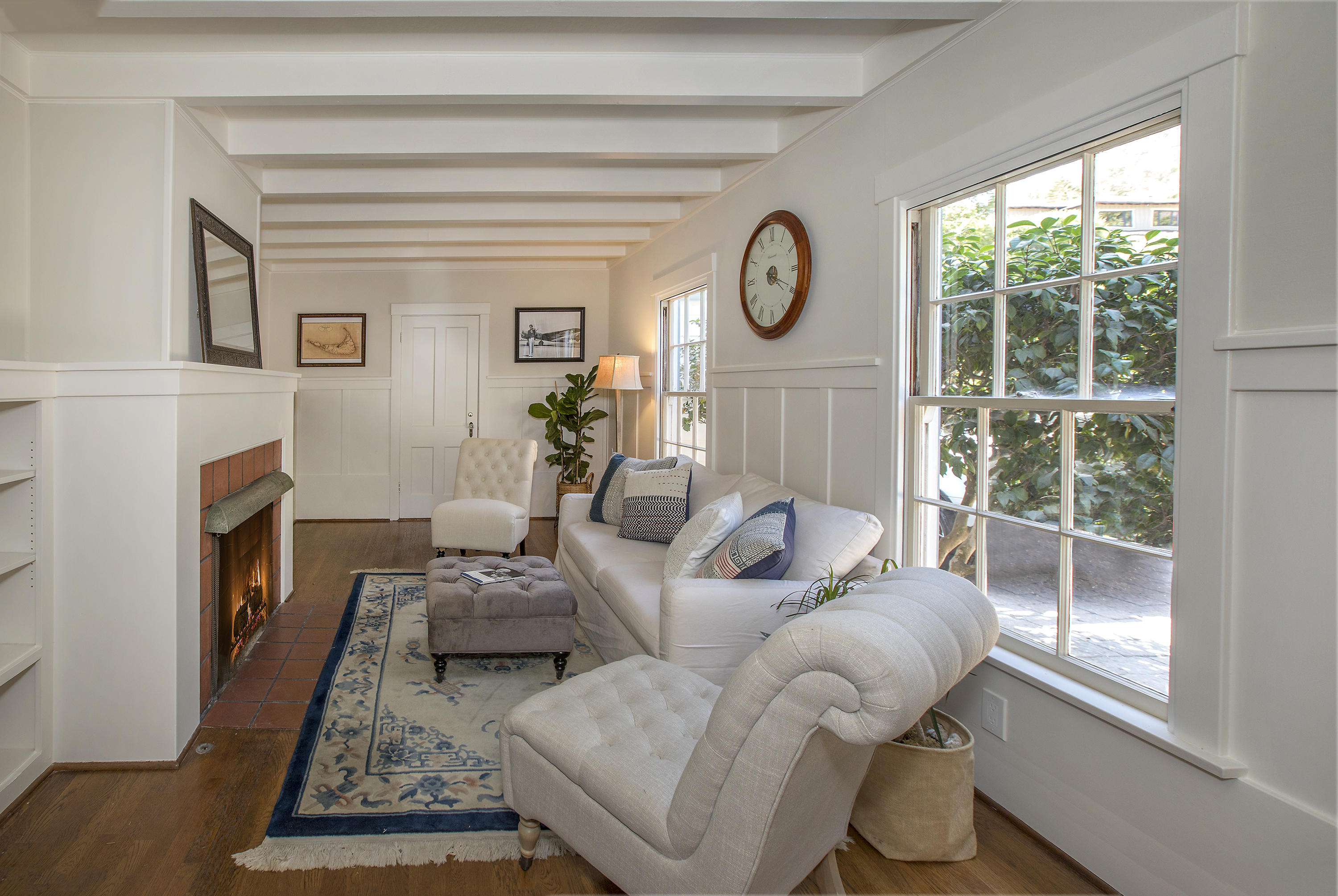 1415 Dover Road Santa Barbara, CA 93103 - Photo 18 of 40 a living room with furniture a fireplace and a window