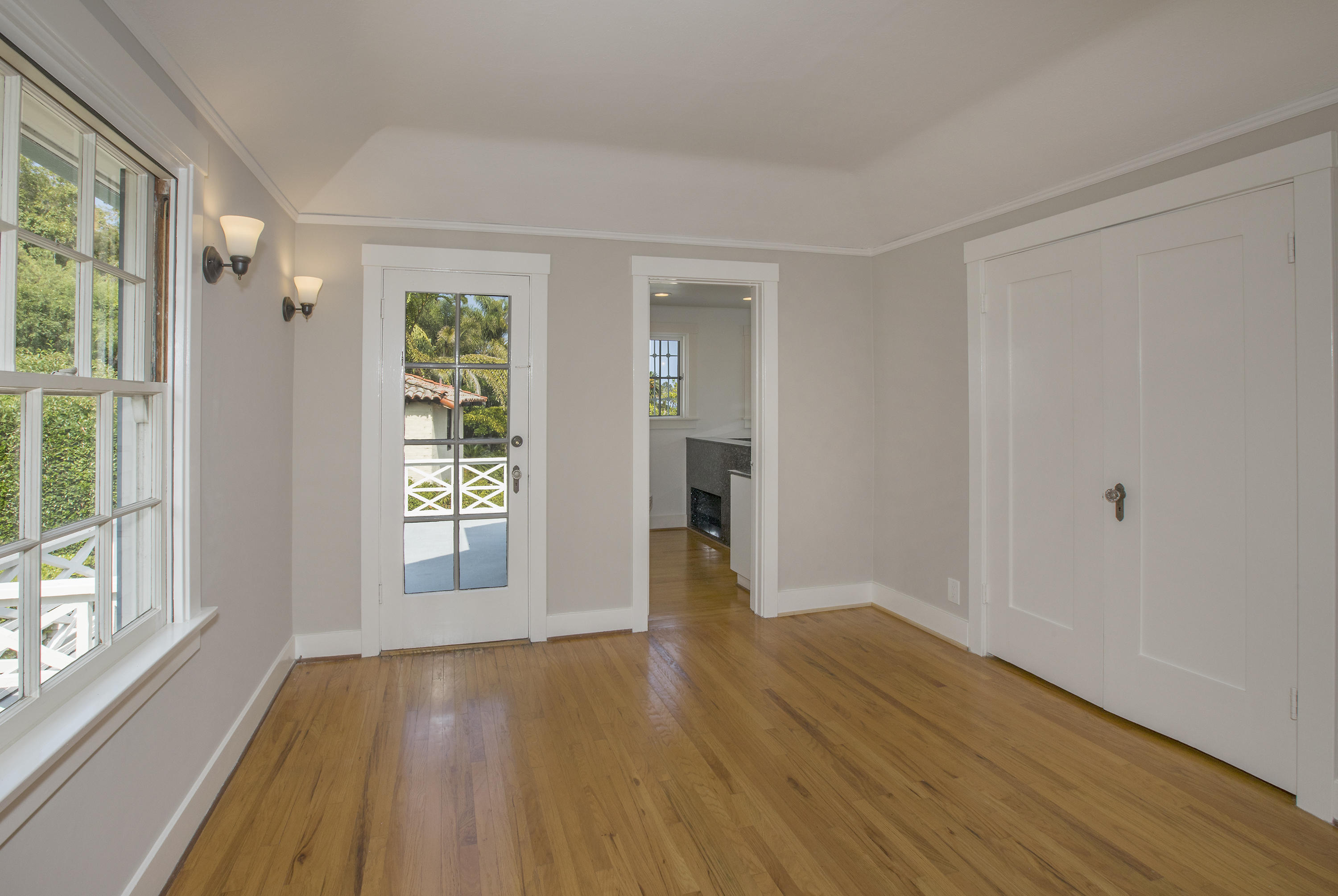 1415 Dover Road Santa Barbara, CA 93103 - Photo 25 of 40 a view of an empty room with wooden floor and a window