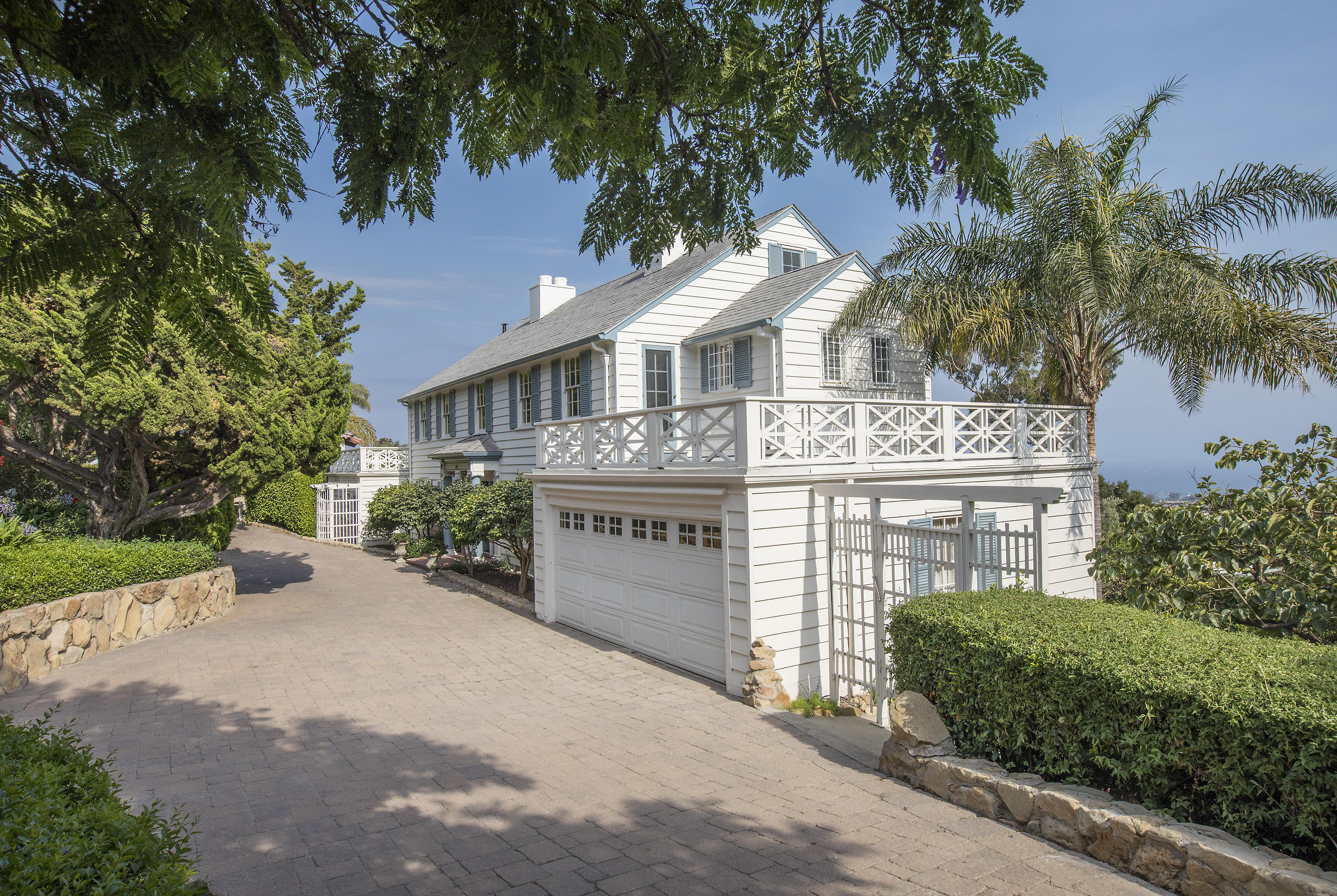 1415 Dover Road Santa Barbara, CA 93103 - Photo 36 of 40 a front view of a house with a garden and tree