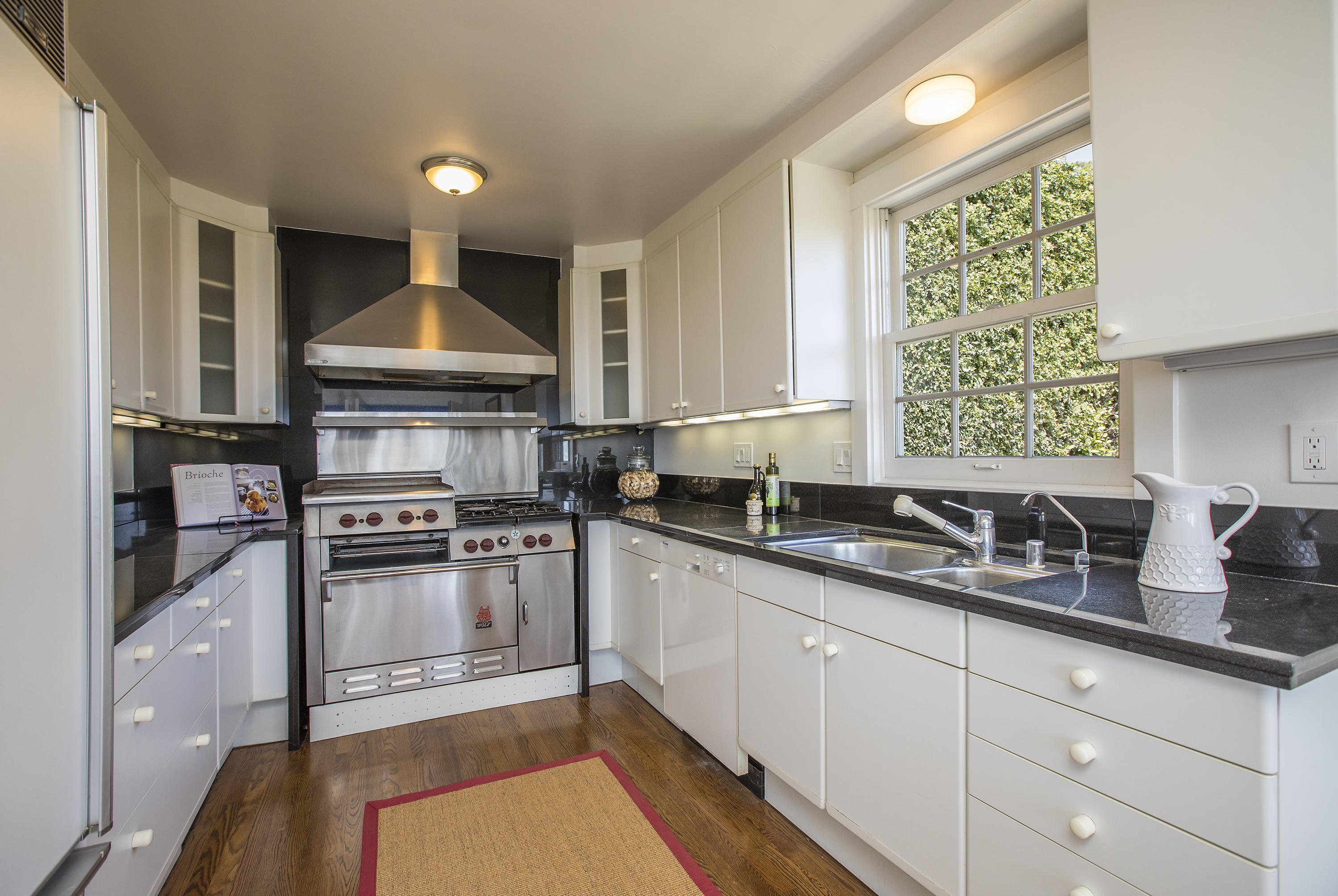 1415 Dover Road Santa Barbara, CA 93103 - Photo 9 of 40 a kitchen with stainless steel appliances granite countertop a sink stove and refrigerator