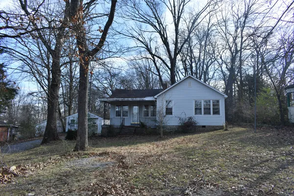 a house with trees in front of it