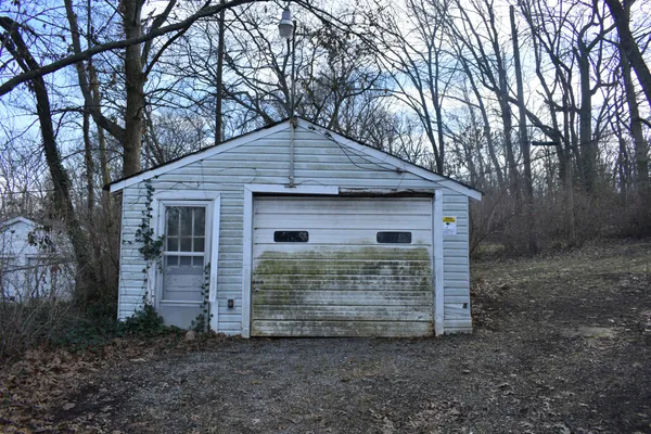 a view of house with trees in the background