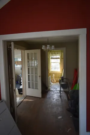 a very nice looking room with a large window and a ceiling fan