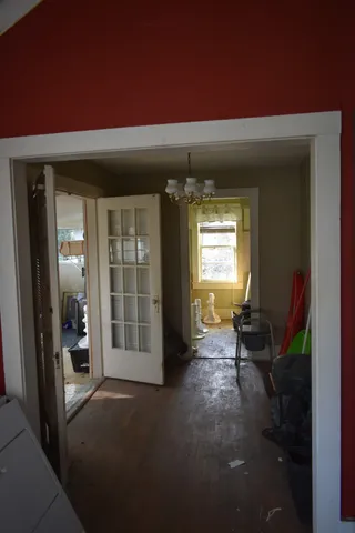 a very nice looking room with a large window and a ceiling fan